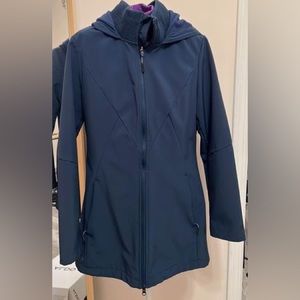 Lightweight blue coat, puffy inside. Size M and true to size.